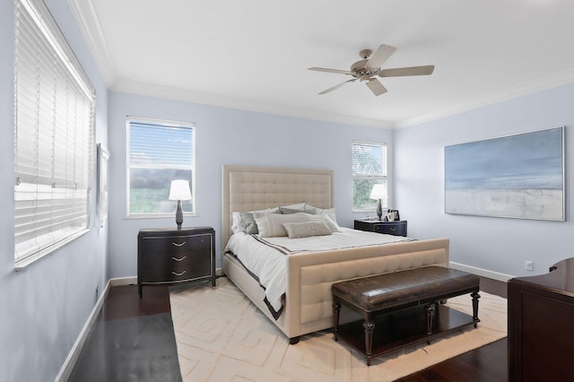 bedroom with hardwood / wood-style floors, ceiling fan, and crown molding