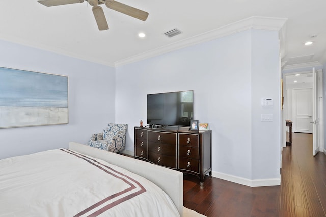 bedroom with dark hardwood / wood-style floors, ceiling fan, and crown molding