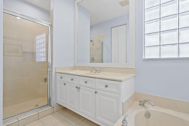 143 Isle Verde Way, Palm Beach Gardens, FL 33418 - bathroom featuring a stall shower, vanity, a garden tub, and tile patterned flooring