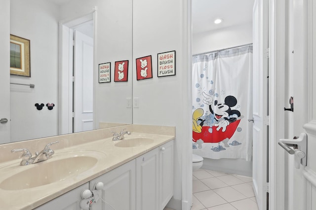 143 Isle Verde Way, Palm Beach Gardens, FL 33418 - full bathroom featuring toilet, tile patterned flooring, double vanity, and shower / tub combo