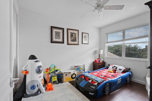 bedroom featuring ceiling fan and dark wood-type flooring