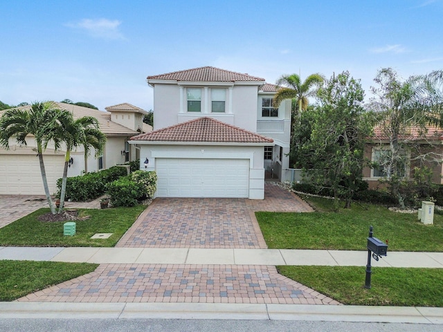 143 Isle Verde Way, Palm Beach Gardens, FL 33418 - mediterranean / spanish-style house featuring a tiled roof, stucco siding, decorative driveway, and a front lawn