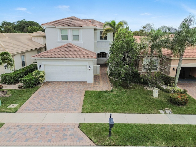 mediterranean / spanish-style home with a front yard