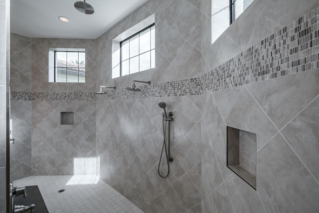 bathroom with a tile shower