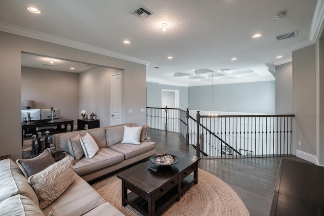 living room with crown molding, a chandelier, hardwood / wood-style flooring, and coffered ceiling