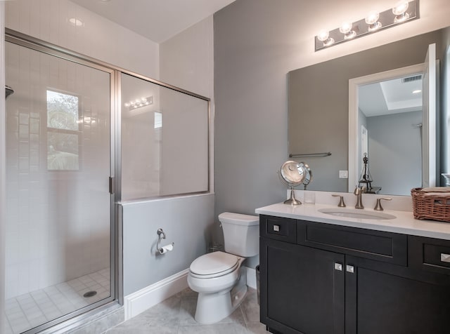 bathroom featuring tile patterned flooring, a shower with door, toilet, and vanity