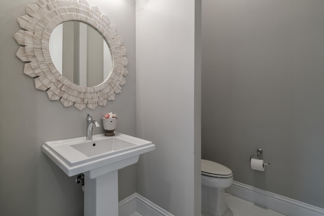 bathroom with tile patterned floors and toilet