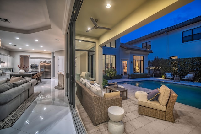 view of patio / terrace with ceiling fan, a fenced in pool, and outdoor lounge area