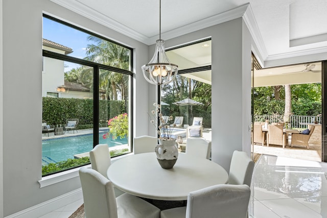 tiled dining room with an inviting chandelier and ornamental molding