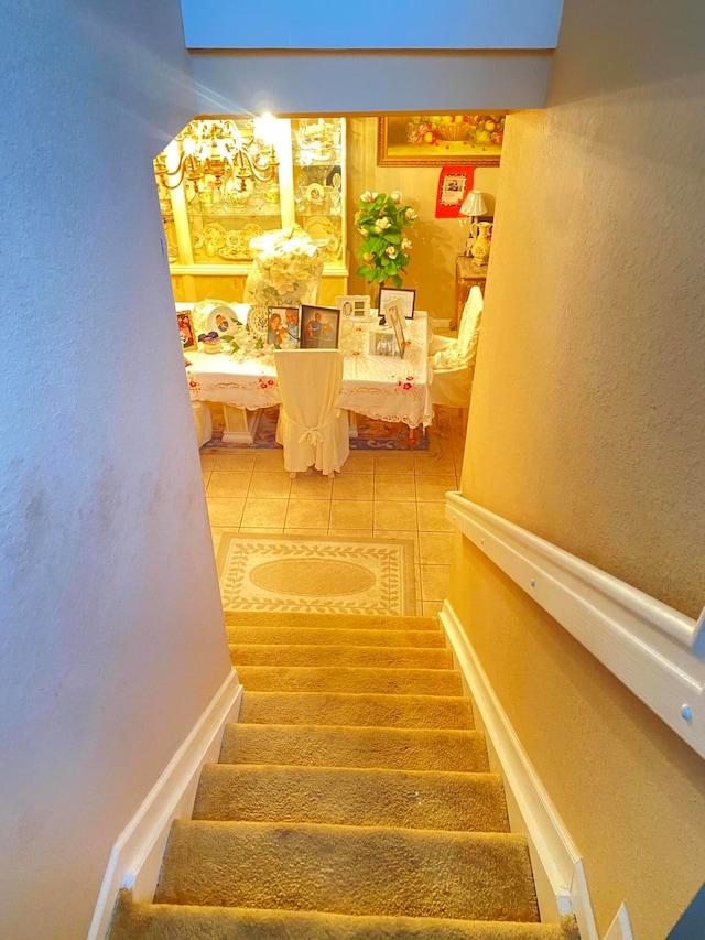 stairway with tile patterned flooring