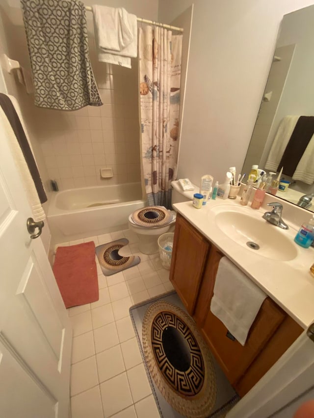 full bathroom featuring vanity, toilet, tile patterned floors, and shower / bath combo