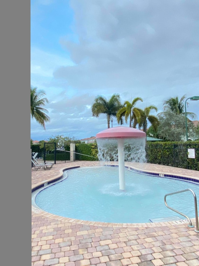 view of pool featuring pool water feature