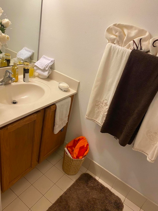 bathroom with tile patterned flooring and vanity