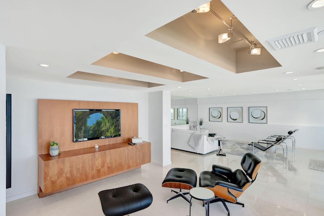 living room with a tray ceiling