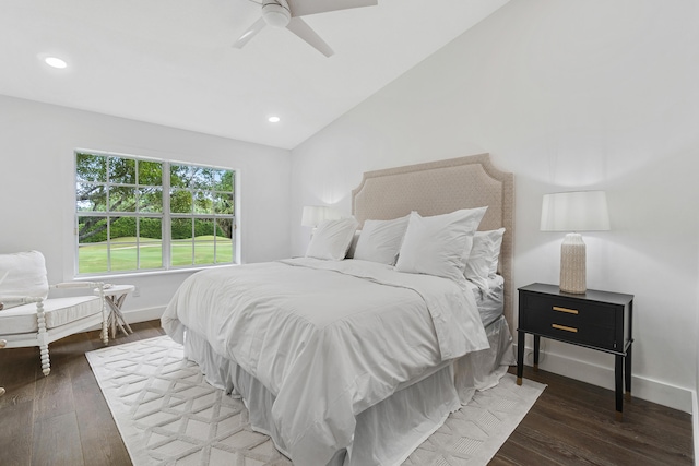 bedroom with ceiling fan, hardwood / wood-style flooring, and vaulted ceiling