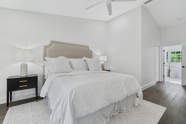 bedroom featuring hardwood / wood-style floors, high vaulted ceiling, ensuite bathroom, and ceiling fan