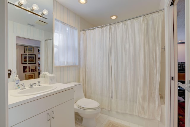 full bathroom with tile patterned floors, vanity, shower / bath combo, and toilet