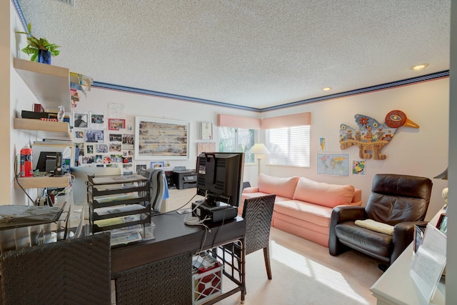 home office featuring ornamental molding, carpet floors, and a textured ceiling