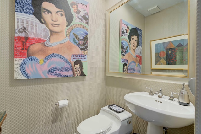 bathroom featuring sink and toilet