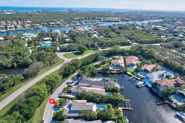 birds eye view of property featuring a water view