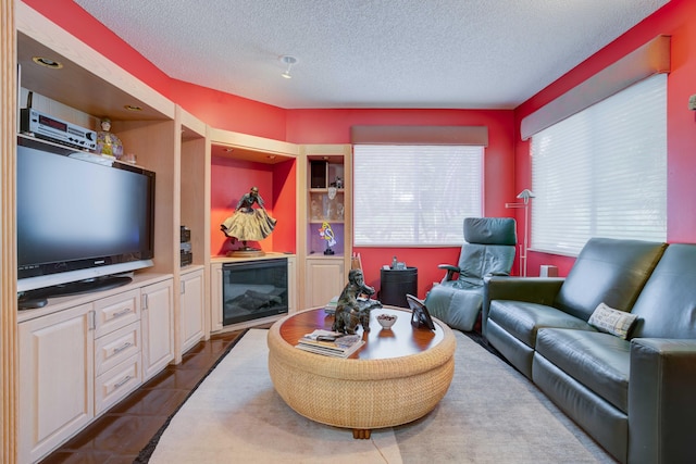 tiled living room with a textured ceiling