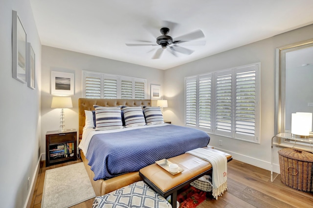 bedroom featuring light wood-type flooring and ceiling fan