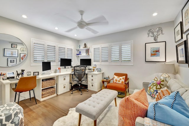 office featuring light hardwood / wood-style floors and ceiling fan