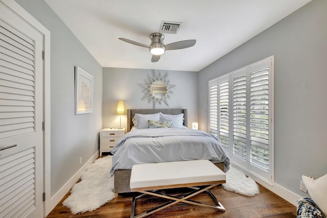 bedroom with hardwood / wood-style floors and ceiling fan