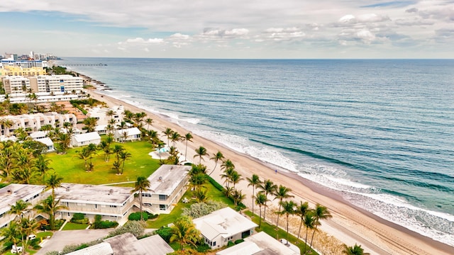 bird's eye view featuring a water view and a view of the beach