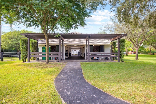 exterior space featuring a yard and a carport