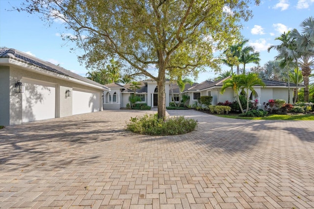 single story home with a garage