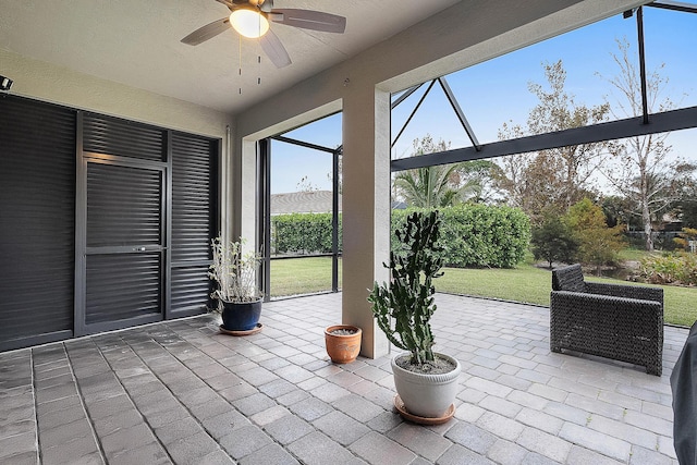 view of patio / terrace featuring a lanai and ceiling fan