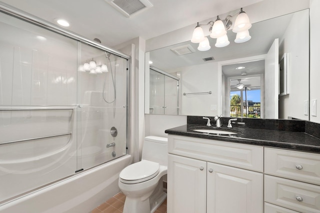 full bathroom with shower / bath combination with glass door, ceiling fan, toilet, tile patterned floors, and vanity