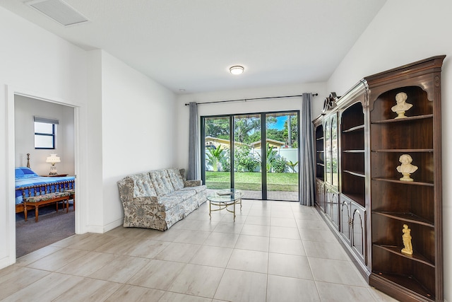 sitting room featuring light tile floors