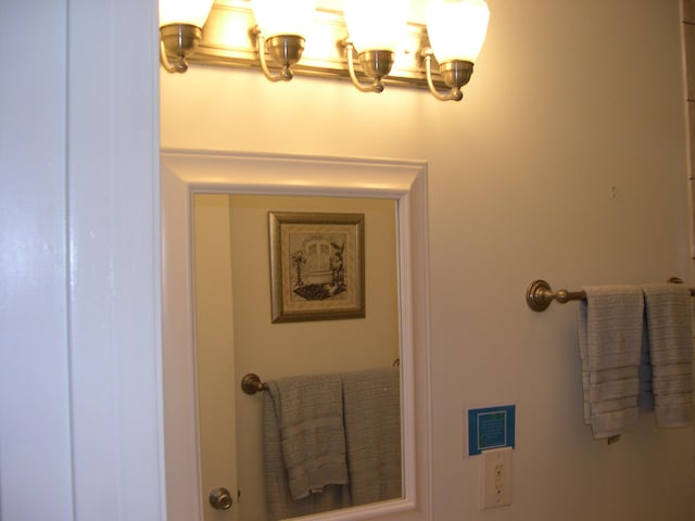 bathroom featuring a notable chandelier