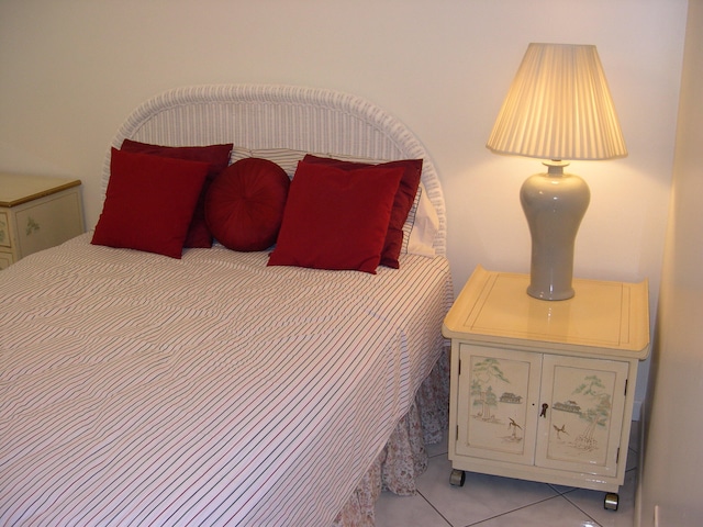 bedroom with light tile patterned floors