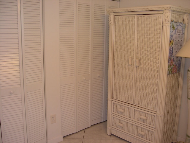 unfurnished bedroom with light tile patterned floors