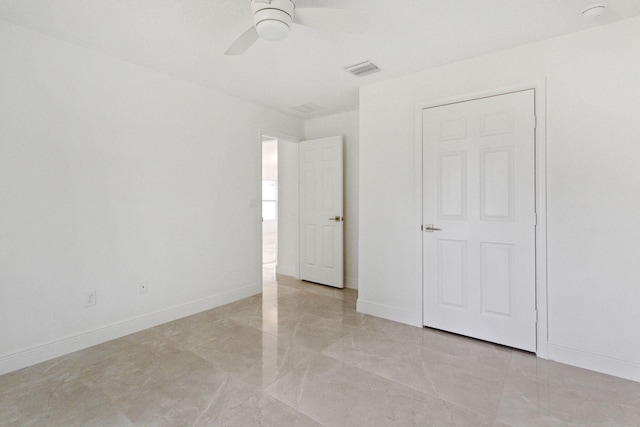 unfurnished bedroom featuring ceiling fan