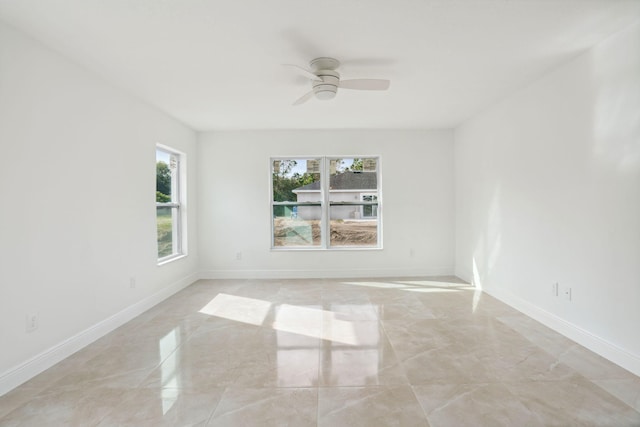 spare room with ceiling fan