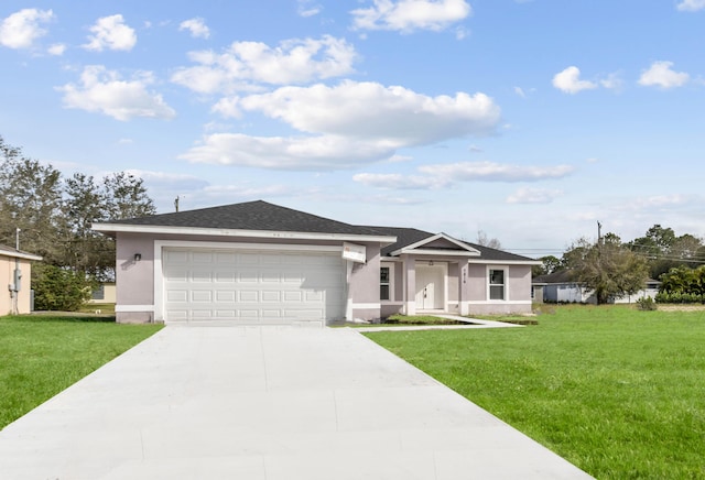 view of front of home featuring a garage and a front lawn