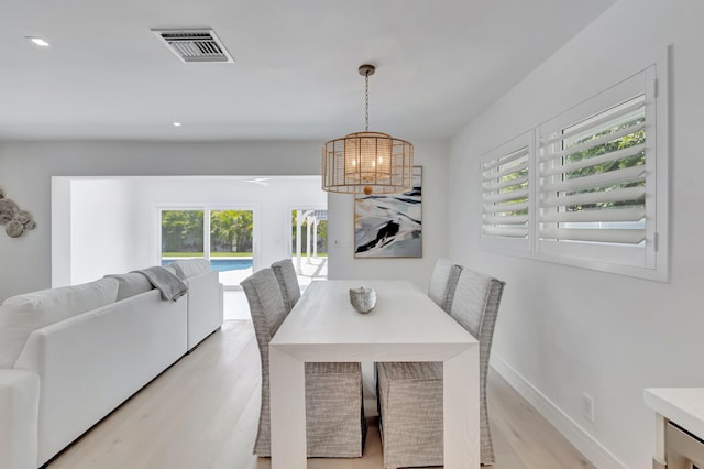 530 NW 14th St, Delray Beach, FL 33444 - dining area with a chandelier, light wood-type flooring, healthy amount of natural light, recessed lighting, and baseboards