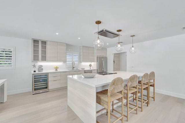 530 NW 14th St, Delray Beach, FL 33444 - kitchen with beverage cooler, a sink, freestanding refrigerator, modern cabinets, and recessed lighting