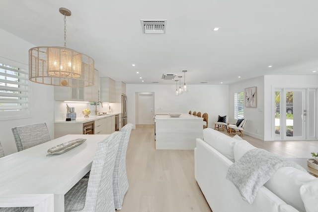 530 NW 14th St, Delray Beach, FL 33444 - dining room with a chandelier, light wood-style floors, and recessed lighting