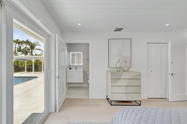 530 NW 14th St, Delray Beach, FL 33444 - bedroom featuring access to outside, ensuite bath, light wood-style flooring, baseboards, and recessed lighting