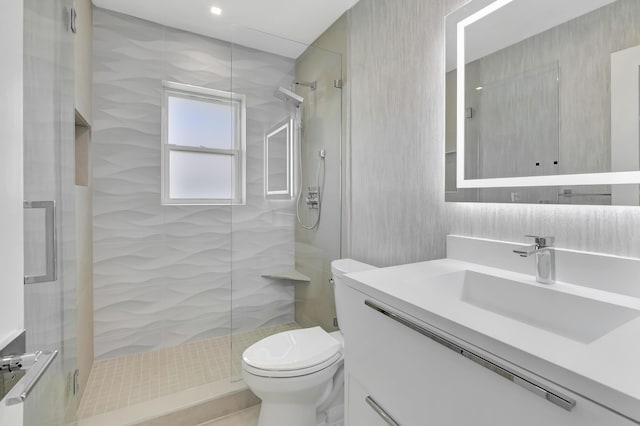 530 NW 14th St, Delray Beach, FL 33444 - bathroom featuring toilet, a walk in shower, vanity, and wallpapered walls