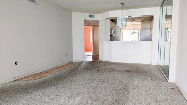 interior space with a textured ceiling