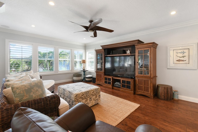 living room featuring wood-type flooring, ceiling fan, and crown molding