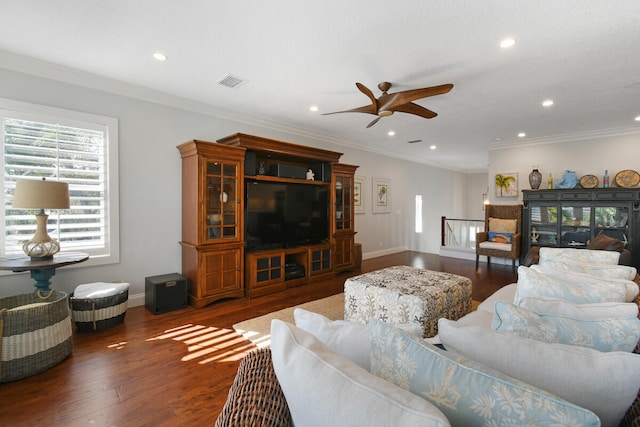 living room featuring dark wood-type flooring, crown molding, and ceiling fan