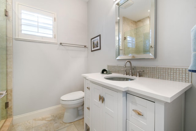 bathroom with vanity, walk in shower, tile patterned flooring, and toilet