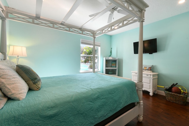 bedroom featuring ceiling fan and dark hardwood / wood-style floors